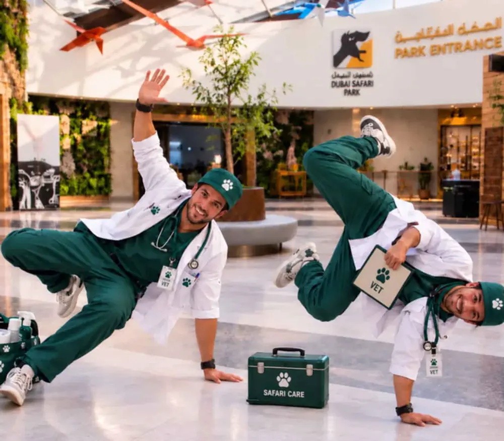 Two vets breakdancing in the Main Building lobby